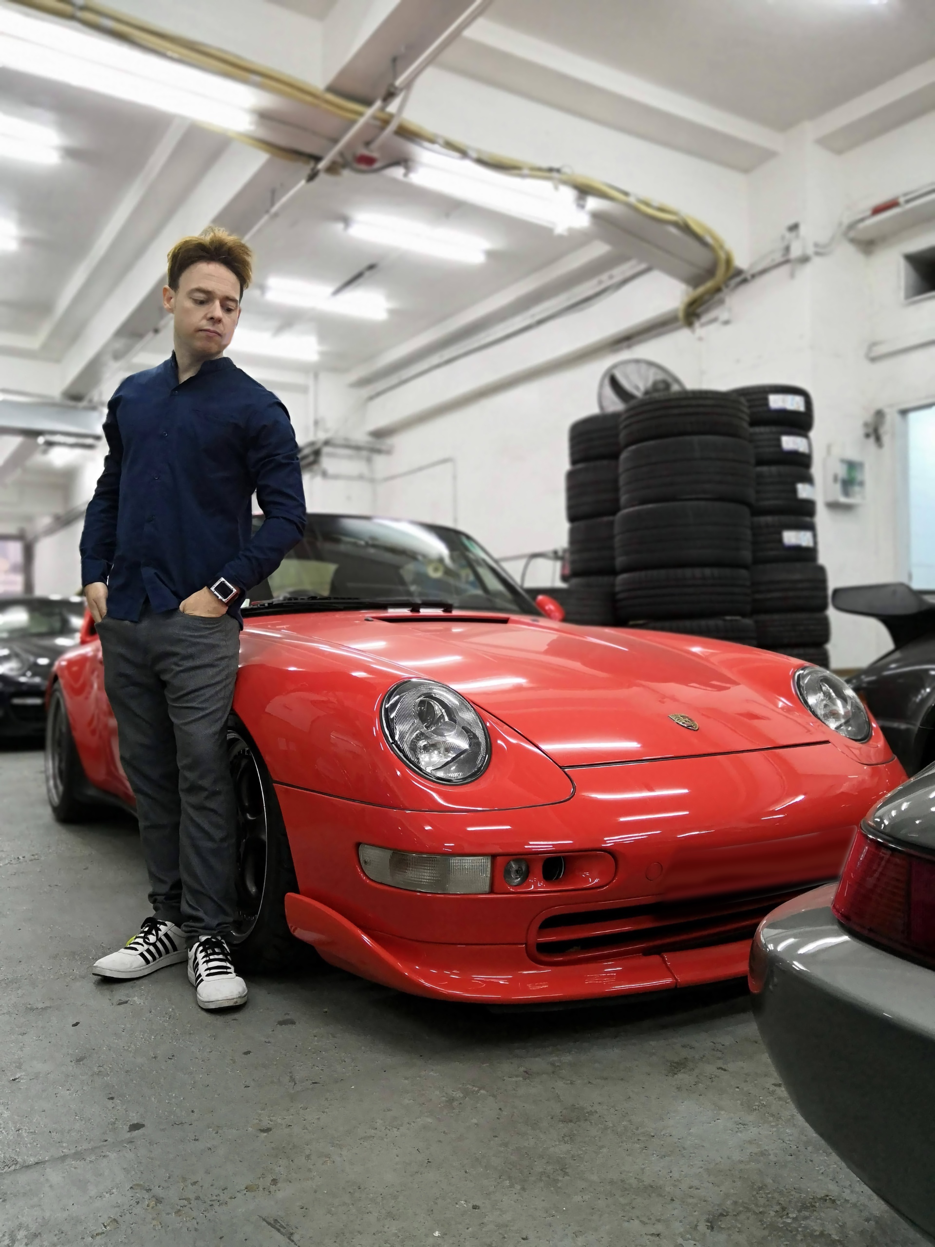 Gregor Hans Schöner standing beside The Schöner Porsche 993 prototype